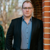 Headshot of director Joshua Borths with Arizona Opera